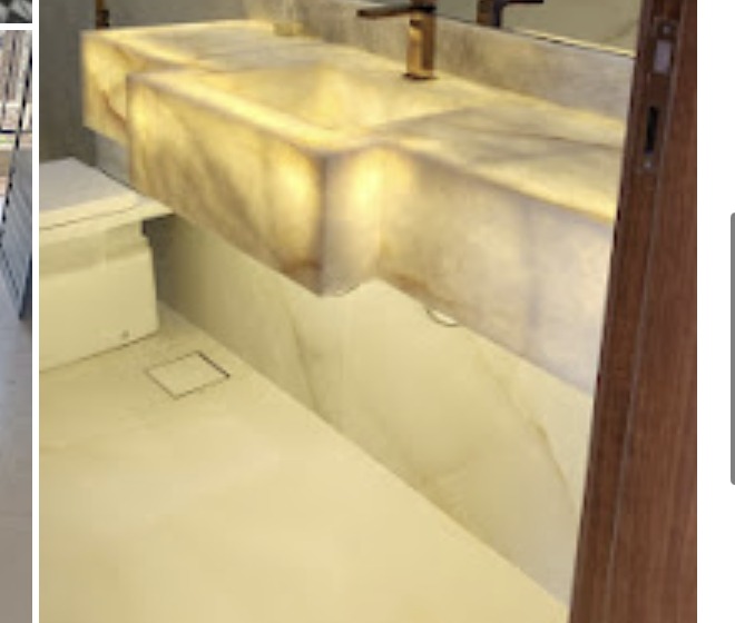 Lavatório em mármore translúcido tipo ônix com iluminação embutida